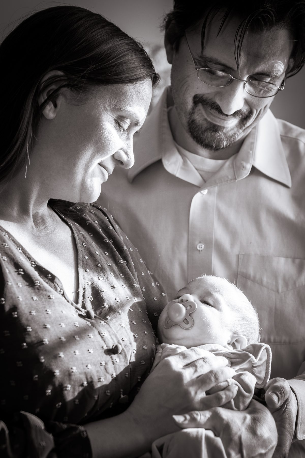Black and white newborn family moment