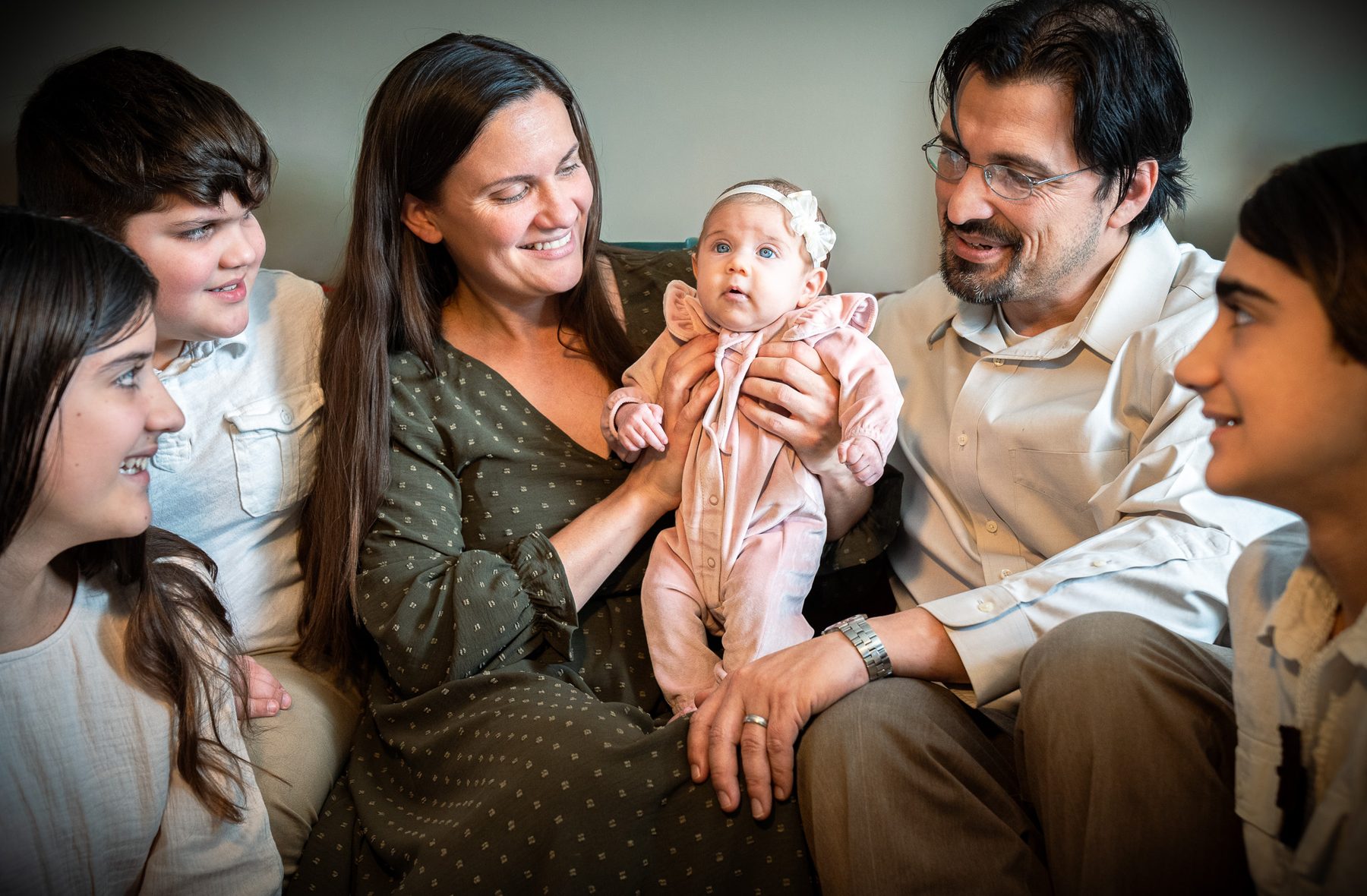 Family gathered around a newborn
