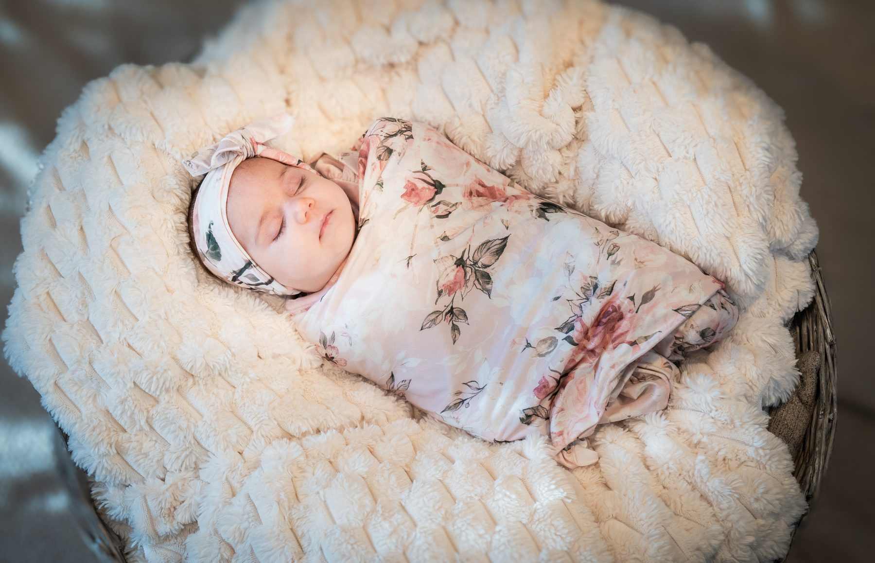 Newborn wrapped in a soft blanket