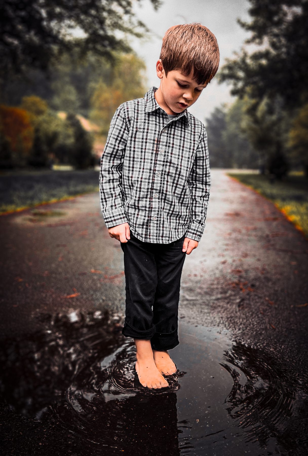 Child portrait near water at sunset