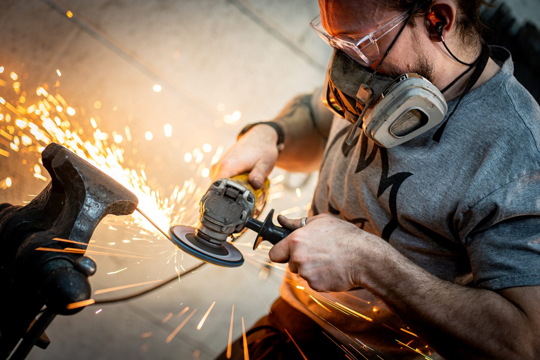 Welder working with sparks in a workshop