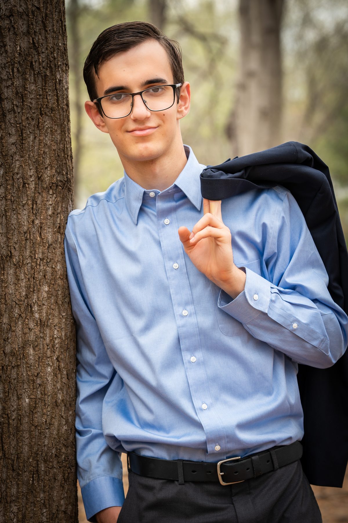 Senior portrait outdoors in a blue shirt