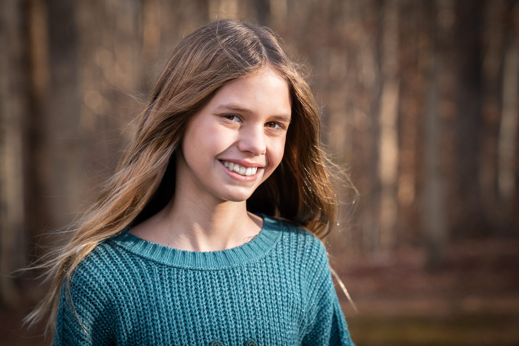 Portrait in a green sweater outdoors